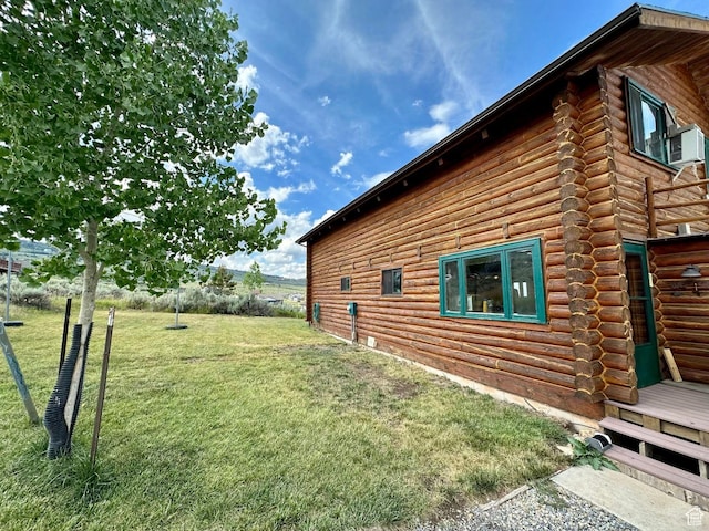 2947 S Chukar Dr, Garden City, UT 84028 - view of side of property featuring log exterior and a lawn