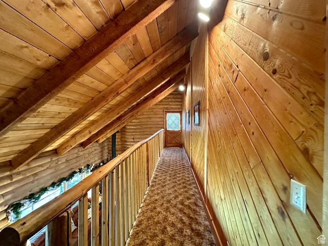 2947 S Chukar Dr, Garden City, UT 84028 - hall featuring wood ceiling, wood walls, and carpet floors