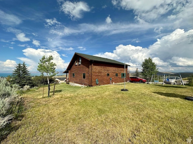 2947 S Chukar Dr, Garden City, UT 84028 - view of home's exterior with a yard and log exterior