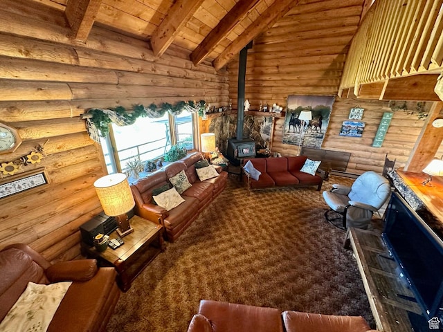 2947 S Chukar Dr, Garden City, UT 84028 - living area with a wood stove, wooden ceiling, and log walls