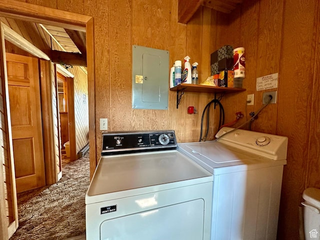 2947 S Chukar Dr, Garden City, UT 84028 - laundry room featuring electric panel, washer and dryer, and wooden walls