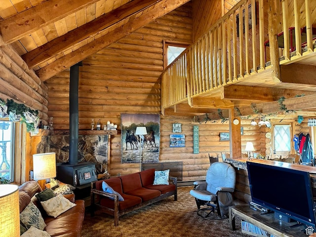 2947 S Chukar Dr, Garden City, UT 84028 - living area with a wood stove, rustic walls, high vaulted ceiling, and a wood ceiling with exposed beams