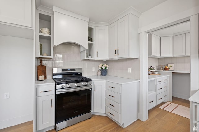 205 S Highland Dr, Santaquin, UT 84655 - kitchen with tasteful backsplash, light countertops, light wood-type flooring, and gas stove