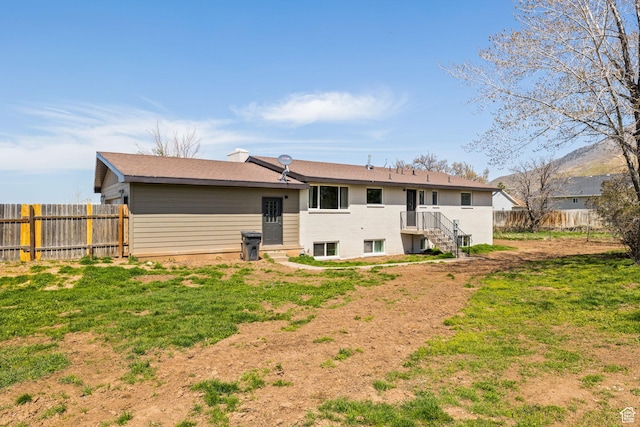 205 S Highland Dr, Santaquin, UT 84655 - rear view of house featuring a fenced backyard and a lawn
