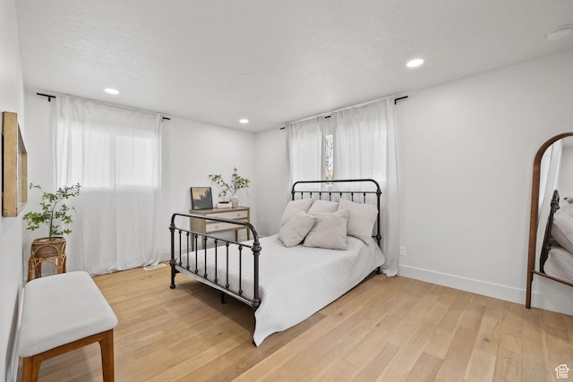 205 S Highland Dr, Santaquin, UT 84655 - bedroom with recessed lighting, light wood-type flooring, and baseboards