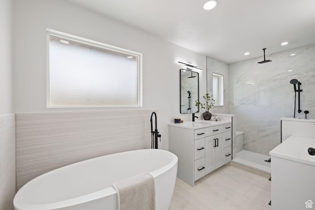 205 S Highland Dr, Santaquin, UT 84655 - bathroom featuring a walk in shower, a freestanding tub, vanity, and recessed lighting