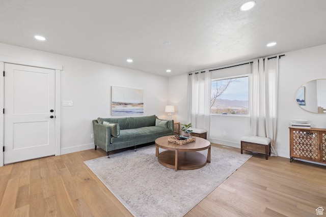 205 S Highland Dr, Santaquin, UT 84655 - living room with light wood finished floors, baseboards, and recessed lighting