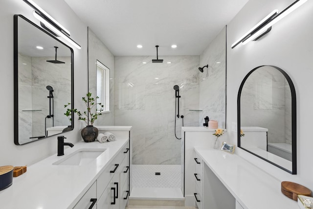 205 S Highland Dr, Santaquin, UT 84655 - bathroom featuring a marble finish shower, vanity, and recessed lighting