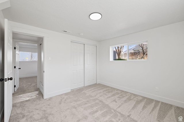 205 S Highland Dr, Santaquin, UT 84655 - unfurnished bedroom with visible vents, baseboards, multiple windows, and carpet floors