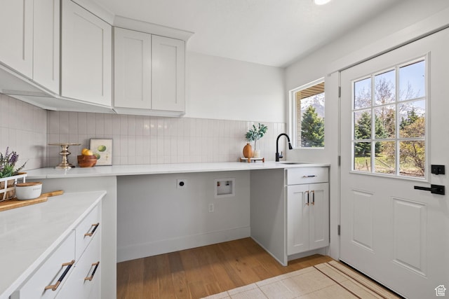 205 S Highland Dr, Santaquin, UT 84655 - washroom featuring electric dryer hookup, washer hookup, cabinet space, light wood finished floors, and a sink