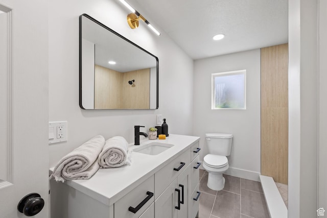 205 S Highland Dr, Santaquin, UT 84655 - bathroom featuring baseboards, toilet, a shower, vanity, and tile patterned flooring