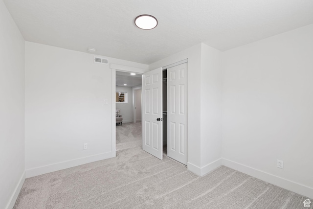 205 S Highland Dr, Santaquin, UT 84655 - unfurnished bedroom featuring a closet, baseboards, visible vents, recessed lighting, and carpet flooring