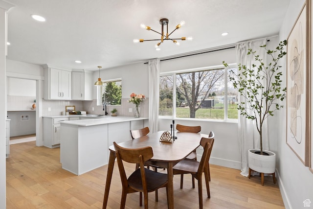 205 S Highland Dr, Santaquin, UT 84655 - dining space featuring recessed lighting, light wood finished floors, baseboards, and an inviting chandelier