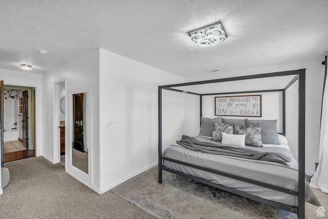 1112 S Granada Royale, Washington, UT 84780 - bedroom featuring baseboards, light colored carpet, and a textured ceiling