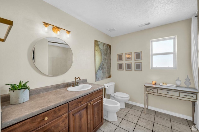 1112 S Granada Royale, Washington, UT 84780 - bathroom with a bidet, vanity, visible vents, and toilet