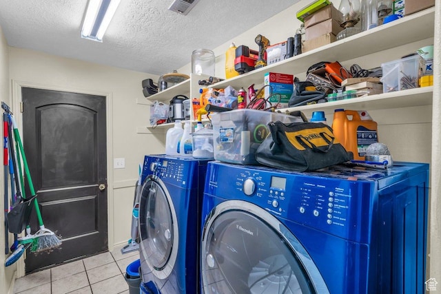 1112 S Granada Royale, Washington, UT 84780 - washroom with visible vents, separate washer and dryer, laundry area, a textured ceiling, and tile patterned flooring
