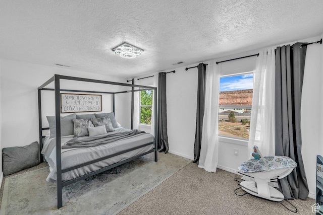 1112 S Granada Royale, Washington, UT 84780 - carpeted bedroom featuring a textured ceiling, baseboards, and visible vents