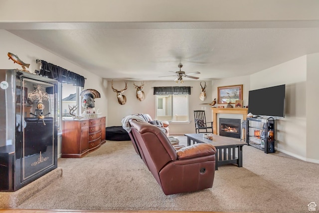 306 W 1240 S, Payson, UT 84651 - living area with a warm lit fireplace, carpet floors, baseboards, and a ceiling fan
