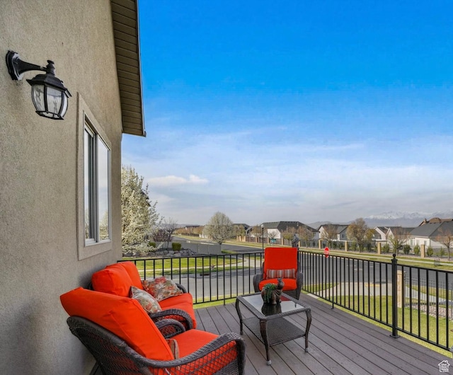 wooden terrace with a residential view