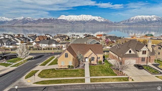 bird's eye view featuring a water and mountain view and a residential view