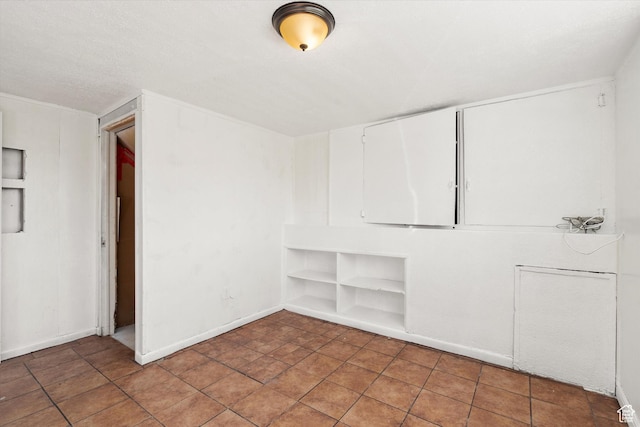 spare room with built in shelves