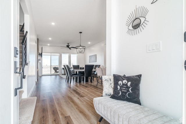 interior space featuring recessed lighting, stairs, and wood finished floors