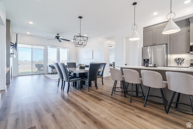 dining space with ceiling fan, recessed lighting, and light wood-style floors