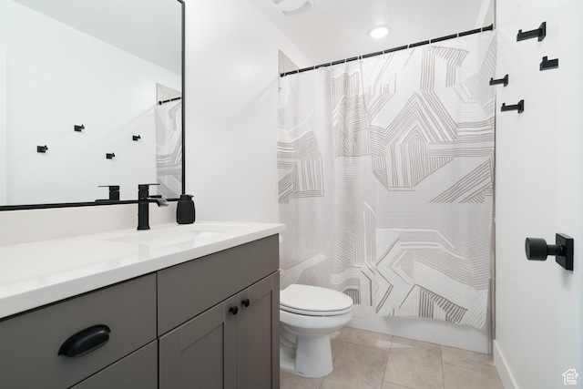 full bathroom with a shower with shower curtain, tile patterned floors, vanity, and toilet