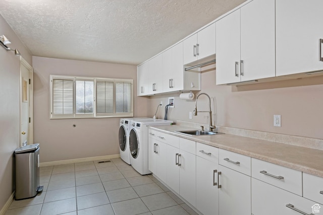 816 E 16th Ave, Salt Lake City, UT 84103 - clothes washing area featuring baseboards, a textured ceiling, separate washer and dryer, a sink, and cabinet space