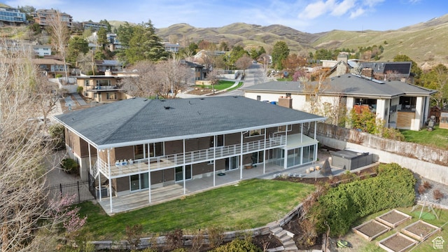 816 E 16th Ave, Salt Lake City, UT 84103 - back of property featuring a fenced backyard, a patio area, roof with shingles, and a mountain view