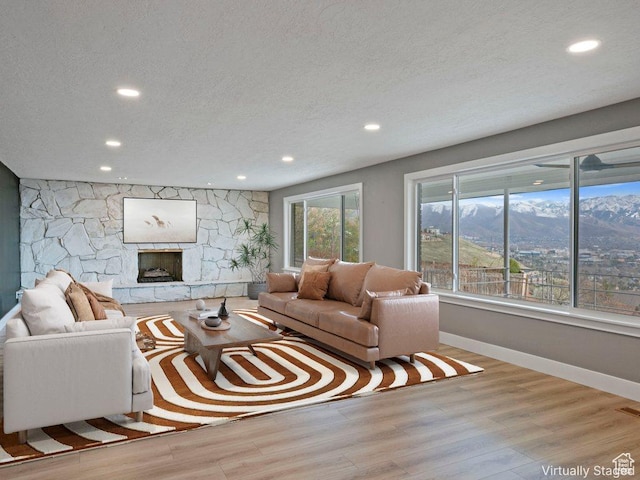 816 E 16th Ave, Salt Lake City, UT 84103 - living area featuring baseboards, a textured ceiling, recessed lighting, and wood finished floors