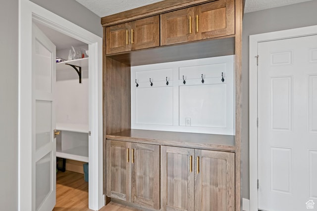 816 E 16th Ave, Salt Lake City, UT 84103 - mudroom featuring light wood finished floors and a textured ceiling