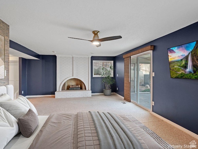 816 E 16th Ave, Salt Lake City, UT 84103 - carpeted bedroom with a brick fireplace, a ceiling fan, baseboards, and access to exterior