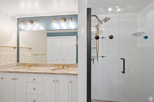 816 E 16th Ave, Salt Lake City, UT 84103 - bathroom featuring double vanity, a sink, and a stall shower