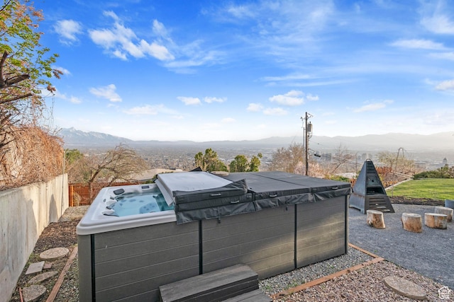 816 E 16th Ave, Salt Lake City, UT 84103 - exterior space featuring a hot tub, a mountain view, and fence
