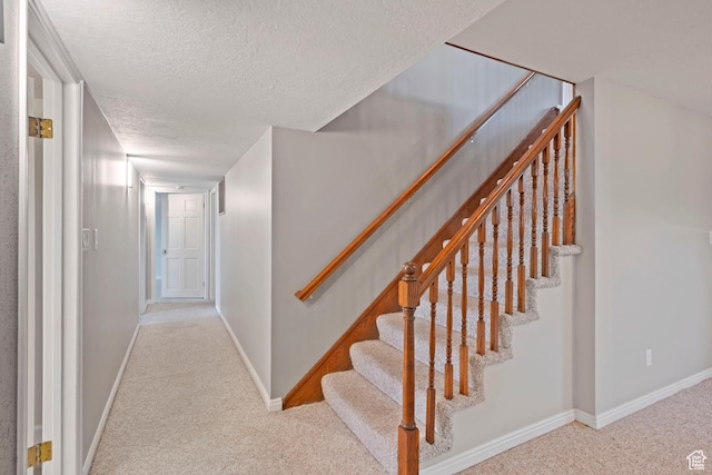 816 E 16th Ave, Salt Lake City, UT 84103 - stairway with baseboards, carpet flooring, and a textured ceiling