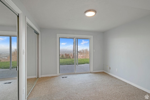 816 E 16th Ave, Salt Lake City, UT 84103 - carpeted empty room featuring baseboards, visible vents, and a wealth of natural light
