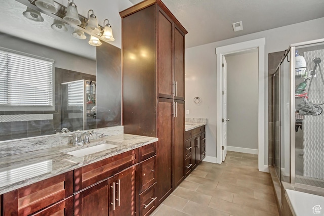 9452 S Alane Hollow Rd W, West Jordan, UT 84081 - full bath with tile patterned flooring, vanity, baseboards, and a stall shower