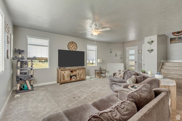 9452 S Alane Hollow Rd W, West Jordan, UT 84081 - living room featuring light carpet, stairs, baseboards, and a ceiling fan