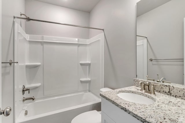 full bathroom featuring toilet, vanity, and shower / washtub combination