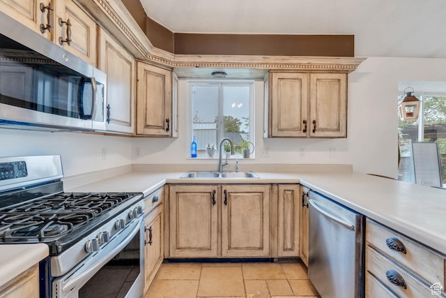 996 W 1340 N, Orem, UT 84057 - kitchen featuring light brown cabinetry, a sink, light countertops, and stainless steel appliances