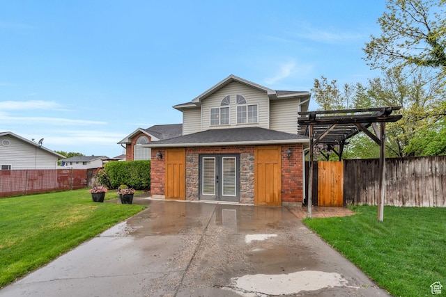 996 W 1340 N, Orem, UT 84057 - view of front of property featuring a front yard, a shingled roof, fence, brick siding, and french doors