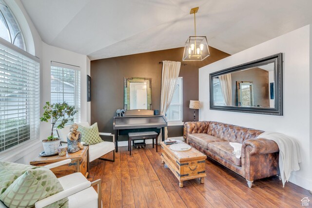 996 W 1340 N, Orem, UT 84057 - living area featuring a chandelier, baseboards, hardwood / wood-style floors, and lofted ceiling