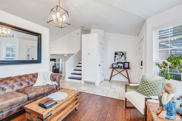 996 W 1340 N, Orem, UT 84057 - living area with visible vents, a wealth of natural light, stairway, and a chandelier