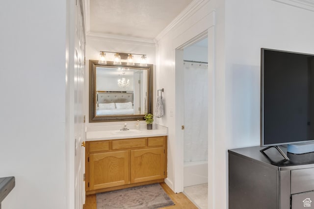 996 W 1340 N, Orem, UT 84057 - ensuite bathroom with crown molding, vanity, ensuite bath, wood finished floors, and shower / tub combo