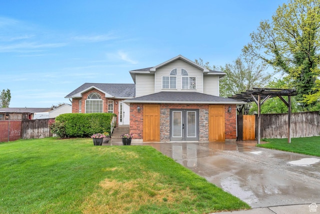 view of front of property featuring a pergola, stone siding, fence, and a front yard