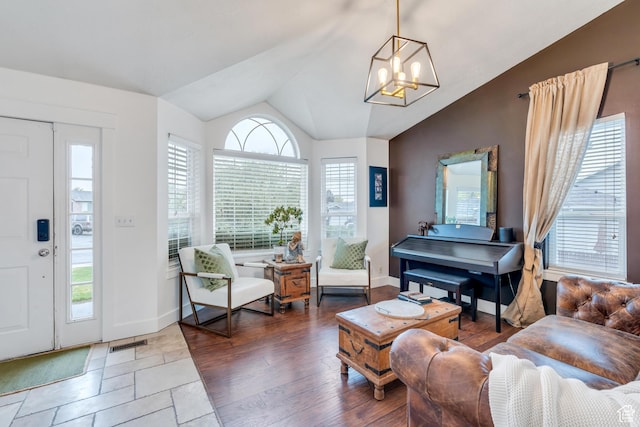 996 W 1340 N, Orem, UT 84057 - living room with baseboards, visible vents, a notable chandelier, and vaulted ceiling