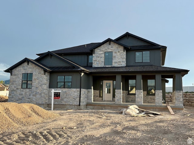 341 N Barlow Ct, Saratoga Springs, UT 84045 - craftsman-style house featuring stone siding, board and batten siding, and covered porch
