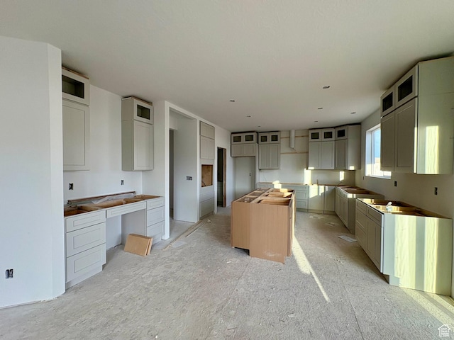341 N Barlow Ct, Saratoga Springs, UT 84045 - kitchen with glass insert cabinets and a kitchen island