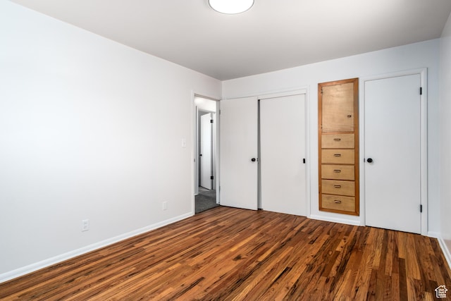 1520 Rushton St, Ogden, UT 84401 - unfurnished bedroom with a closet, baseboards, and wood finished floors